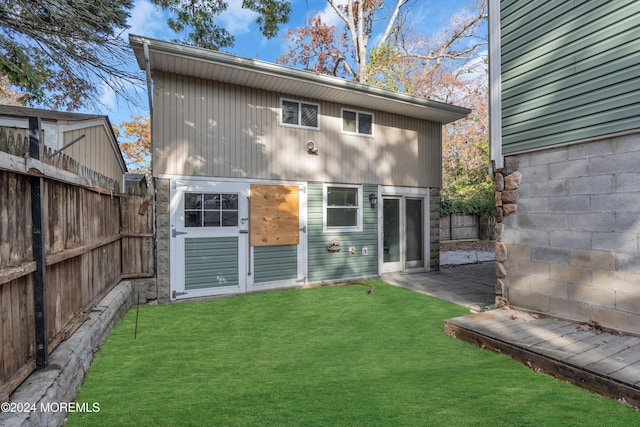 138 Summit Ave, Neptune City, NJ 07753 - rear view of property with a lawn, a patio, and fence