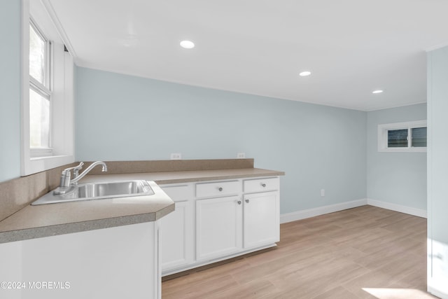 138 Summit Ave, Neptune City, NJ 07753 - clothes washing area featuring recessed lighting, baseboards, a sink, and light wood-style flooring