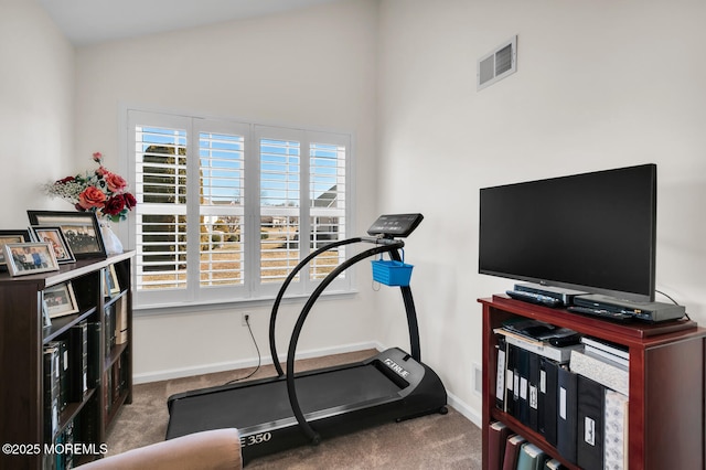 workout room with carpet flooring, visible vents, and baseboards