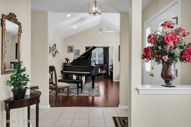 foyer entrance featuring baseboards, ceiling fan, tile patterned floors, vaulted ceiling, and recessed lighting