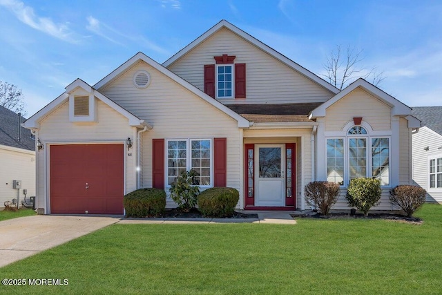 view of front of home with a garage, driveway, and a front lawn