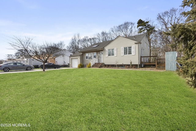 view of front of home with a garage, a front yard, and driveway