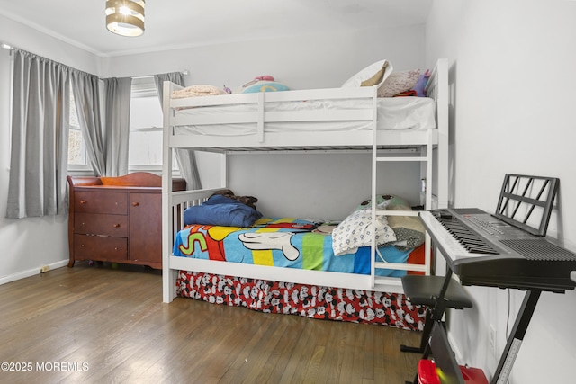 bedroom featuring dark wood-style flooring and baseboards