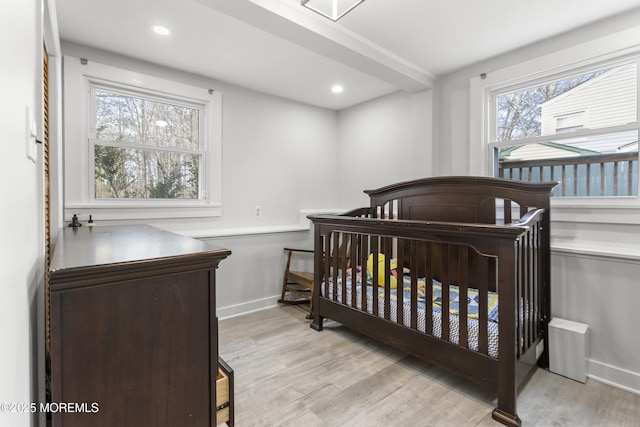 bedroom featuring recessed lighting, baseboards, and light wood finished floors