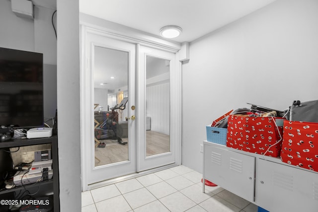 doorway featuring light tile patterned floors