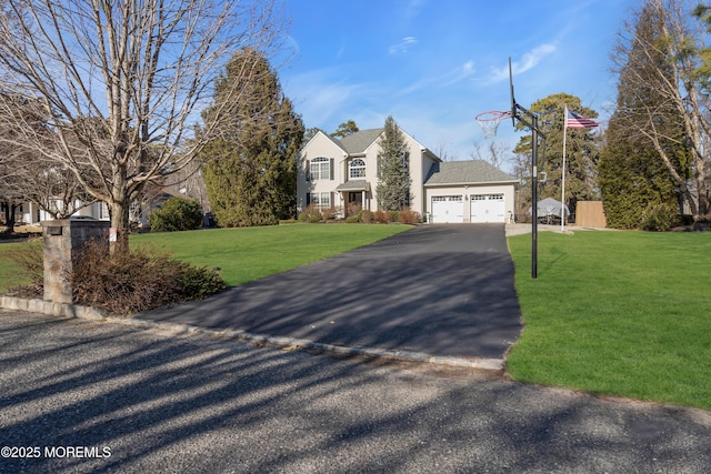 view of front of house featuring a garage and a front yard