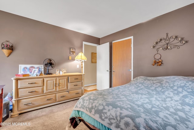 bedroom featuring light colored carpet