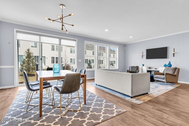 dining space featuring recessed lighting, ornamental molding, wood finished floors, a chandelier, and baseboards