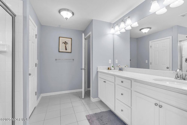 full bath with tile patterned flooring, a shower stall, baseboards, and a sink