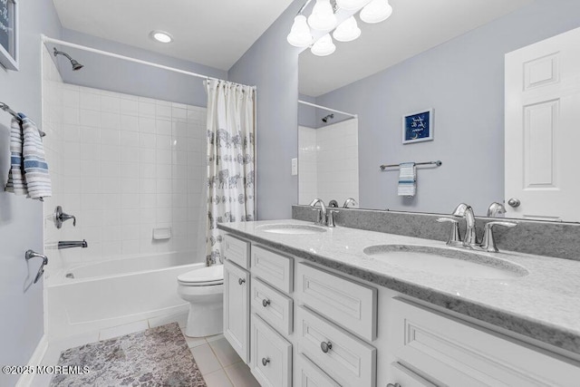 bathroom with shower / tub combo with curtain, a sink, toilet, and tile patterned floors