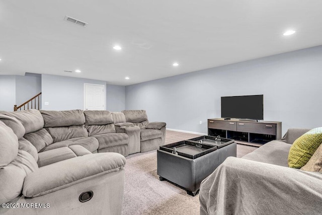 living room featuring light carpet, baseboards, visible vents, and recessed lighting