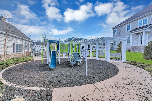 community playground featuring a residential view and a pergola