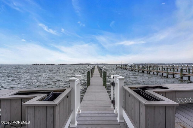 view of dock with a water view