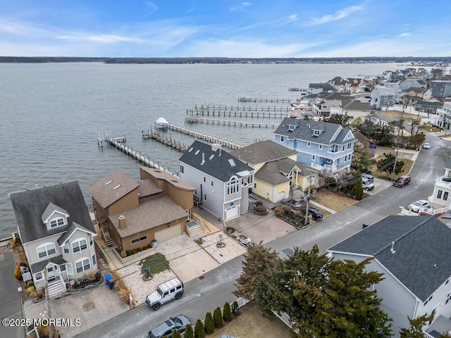 aerial view featuring a residential view and a water view