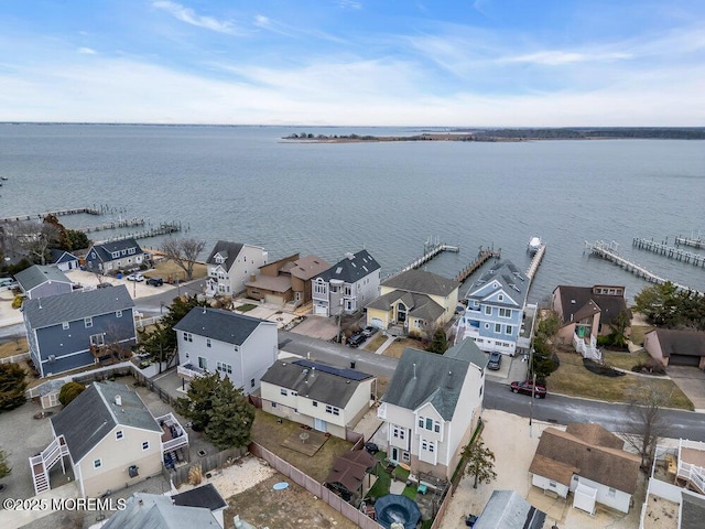 birds eye view of property with a residential view and a water view