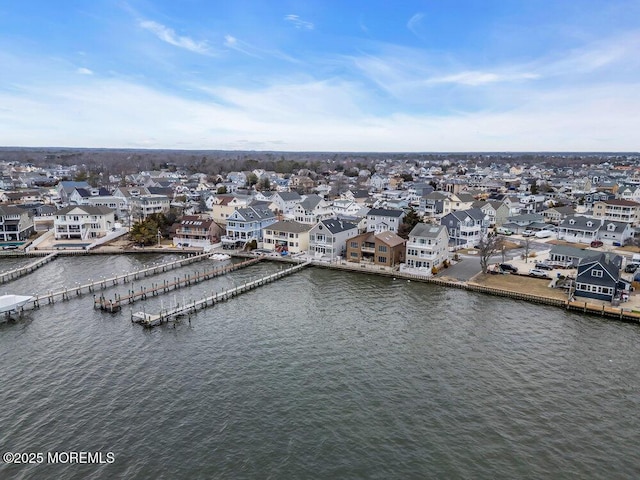 bird's eye view with a water view and a residential view