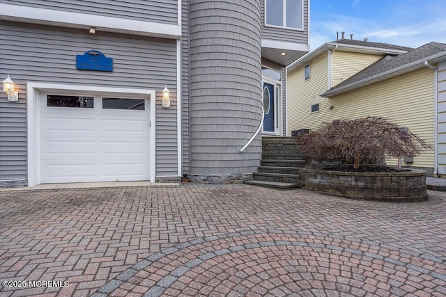 view of exterior entry with a garage