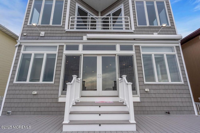 exterior space featuring french doors and a balcony