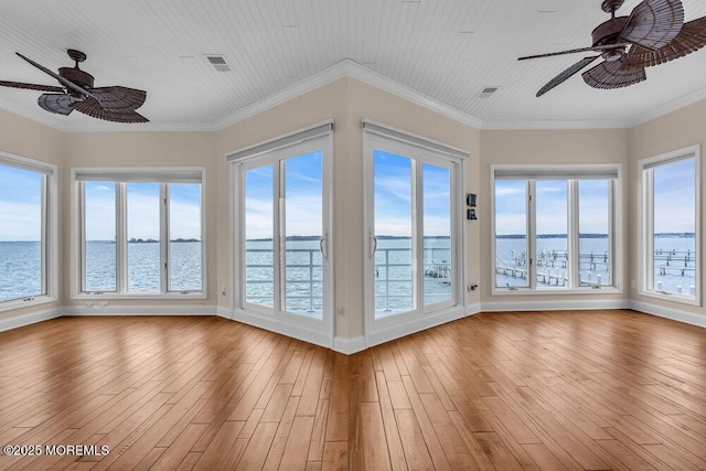 unfurnished sunroom with wood ceiling, visible vents, and ceiling fan