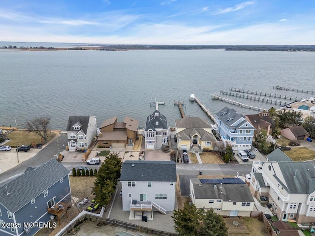 birds eye view of property featuring a water view and a residential view