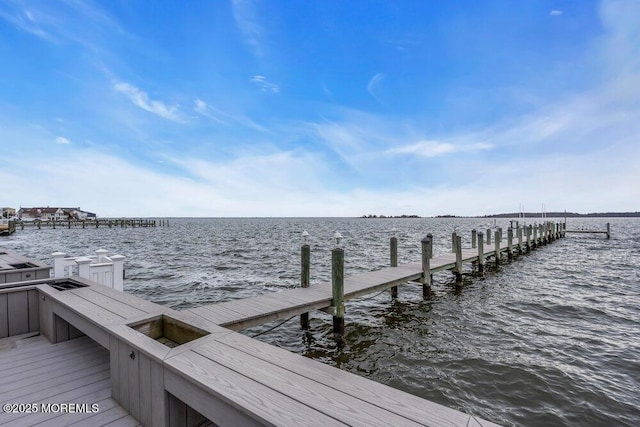 view of dock with a water view