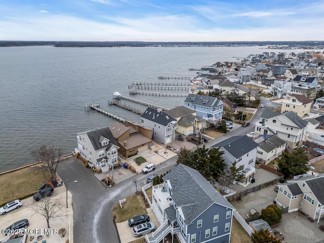 bird's eye view with a water view and a residential view