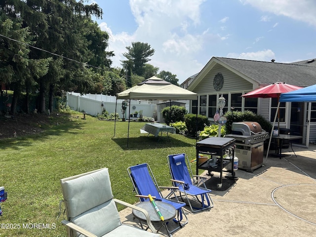 exterior space featuring a gazebo, a patio, and fence