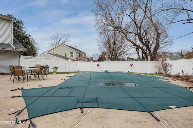 view of pool with a patio, a fenced backyard, and a fenced in pool