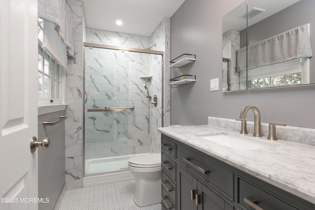 full bath featuring toilet, recessed lighting, vanity, visible vents, and a marble finish shower