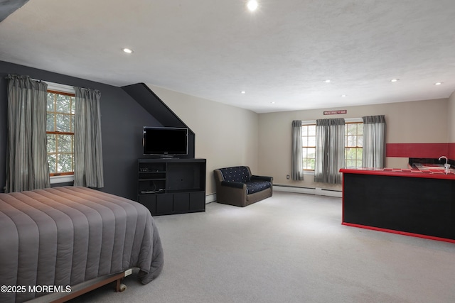 carpeted bedroom with a baseboard radiator, a baseboard heating unit, a sink, and recessed lighting