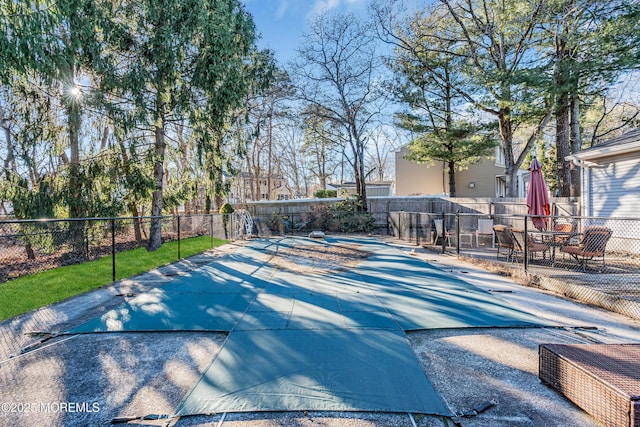 view of pool featuring a patio area and a fenced backyard