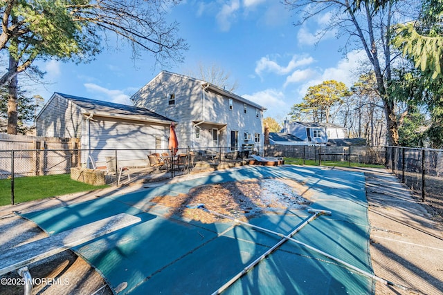 view of pool with a fenced backyard