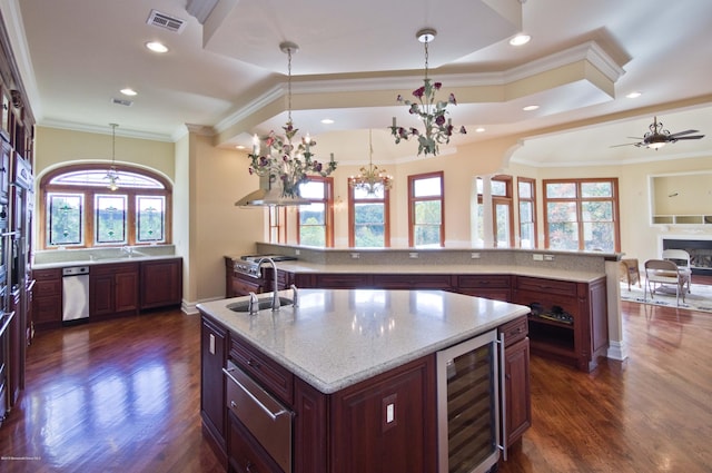 kitchen with visible vents, a large island, wine cooler, a sink, and a warming drawer