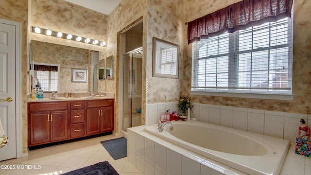 bathroom with a bath, wallpapered walls, a sink, and a stall shower