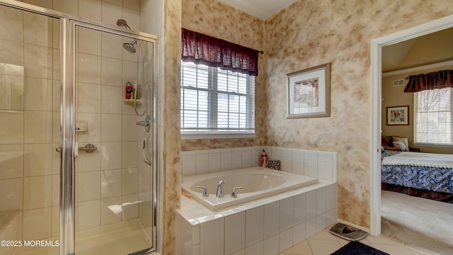 ensuite bathroom featuring ensuite bathroom, a garden tub, visible vents, tile patterned floors, and wallpapered walls