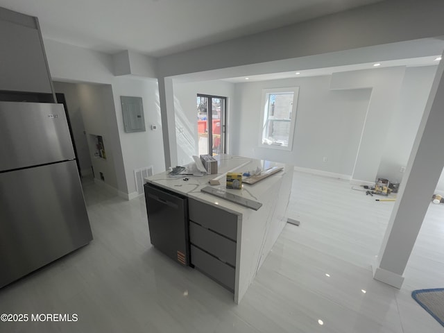 kitchen featuring visible vents, dishwasher, modern cabinets, and freestanding refrigerator