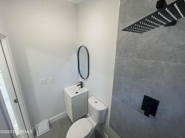 bathroom with tile patterned floors, visible vents, toilet, baseboards, and vanity