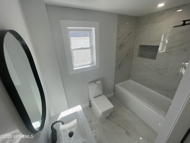 full bathroom with baseboards and marble finish floor