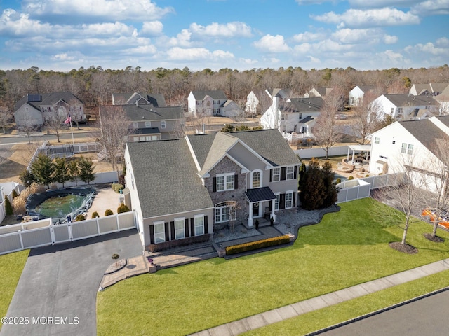 birds eye view of property with a residential view