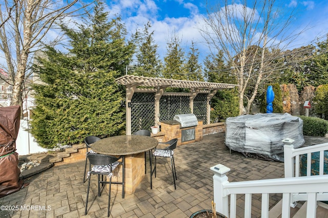 view of patio with outdoor dining space, a grill, and a pergola