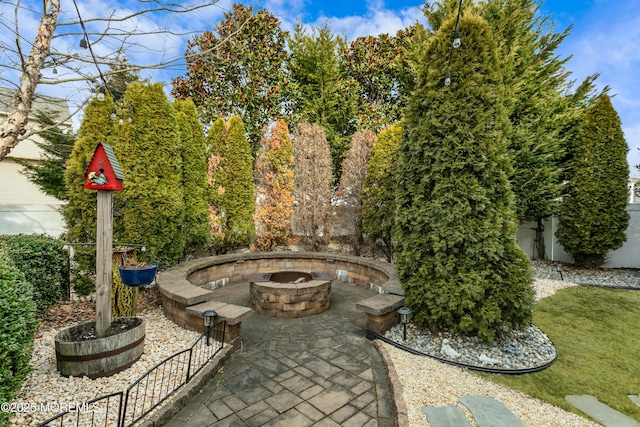 view of patio / terrace featuring an outdoor fire pit