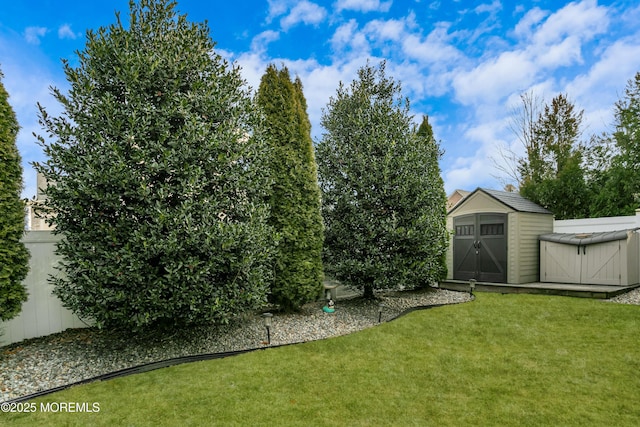 view of yard with an outbuilding and a shed