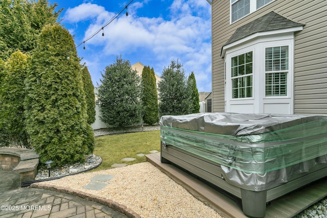 view of yard featuring a hot tub