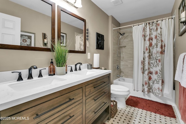 bathroom with double vanity, shower / bath combo, visible vents, and a sink