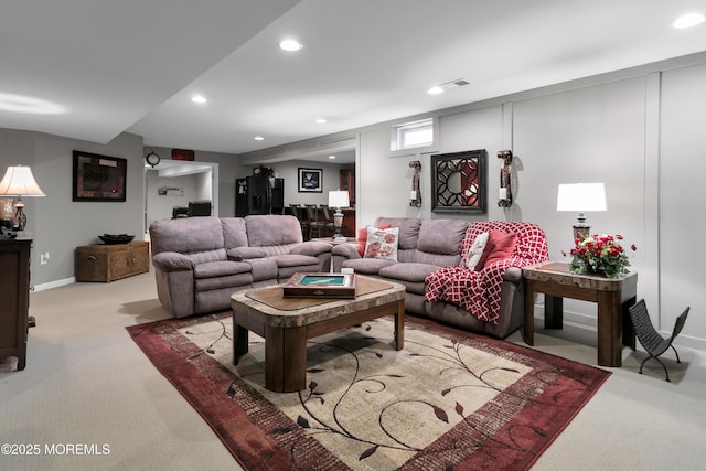 living area featuring carpet, visible vents, baseboards, and recessed lighting