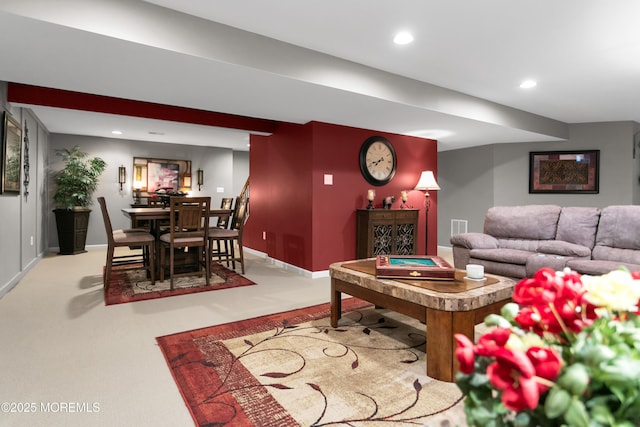 living room featuring baseboards, carpet floors, visible vents, and recessed lighting