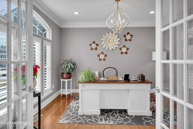 office area with french doors, crown molding, baseboards, and wood finished floors