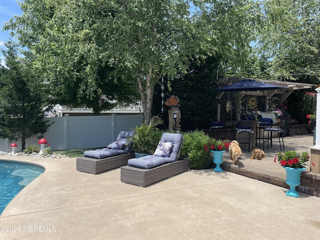 view of patio / terrace featuring fence and a fenced in pool