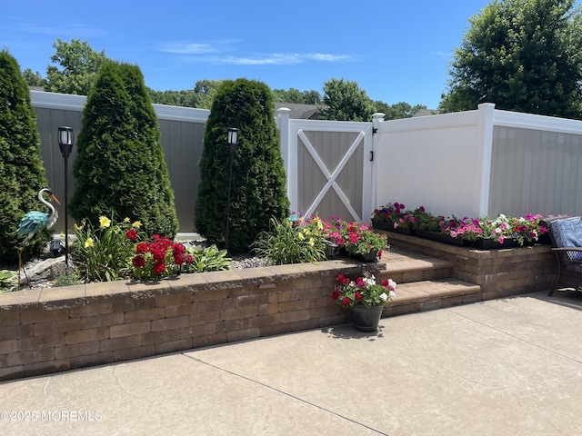 exterior space featuring a gate and fence