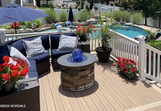 wooden terrace featuring fence and an outdoor living space